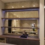 Decorative antique mirror wall panels installed in a kitchen