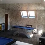 Interior antique full height mirror wall installation reflecting natural daylight
