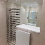 Modern mirror wall feature installed in a London apartment