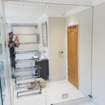Large custom mirror wall panels fitted in a luxury interior