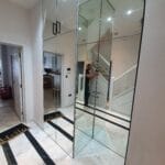 Silver mirror wall panels installed in a hallway