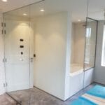 full height mirror wall installation in a residential corridor