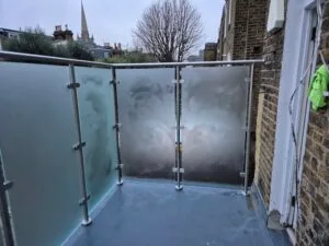 Frameless privacy glass balcony balustrade fitted to residential property in South West London