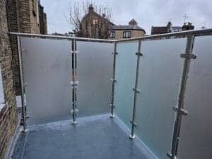Modern privacy glass balustrade system for roof terrace in South West London
