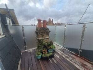 Frameless patio glass privacy screens fitted to outdoor terrace in Putney