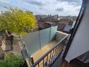 Frameless satin privacy glass balcony without handrail fitted in Fulham