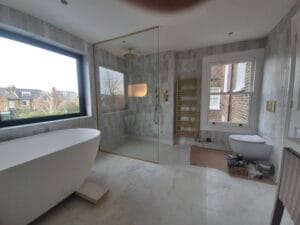 Full height walk in glass shower screen with brushed brass fittings London